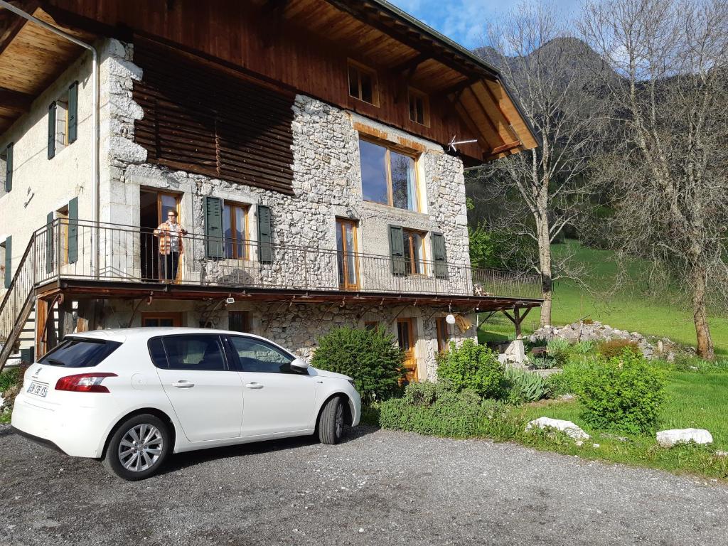 a white car parked in front of a house at Les Chanterelles Montmin in Plan Motmin