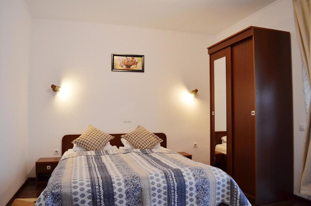 Postel nebo postele na pokoji v ubytování Vila Andrei