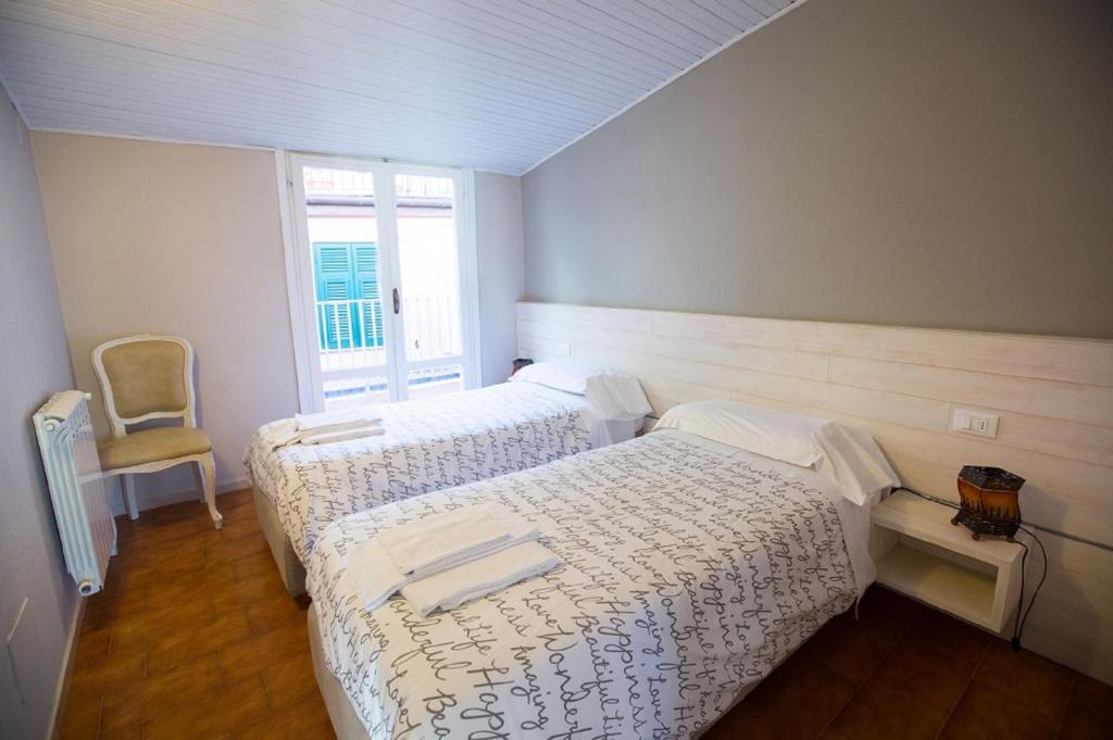 Postel nebo postele na pokoji v ubytování Alla Marina Affittacamere