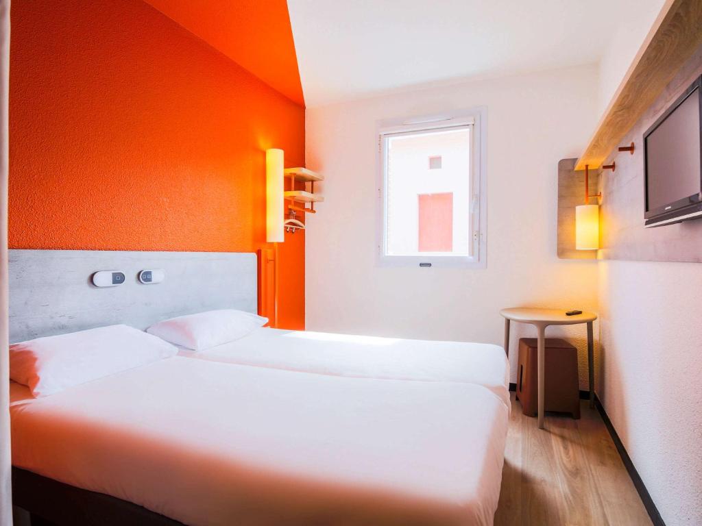 Llit o llits en una habitació de Ibis Budget Albi Centre
