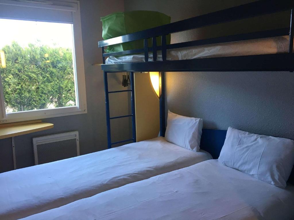 Postel nebo postele na pokoji v ubytování ibis budget Bar le Duc