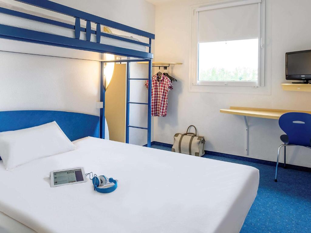 Postel nebo postele na pokoji v ubytování ibis budget Bar le Duc