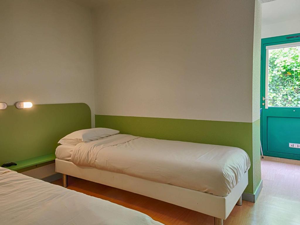 Postel nebo postele na pokoji v ubytování ibis budget Redon