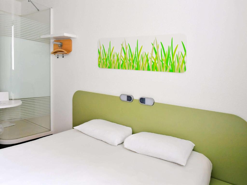 Letto o letti in una camera di ibis budget Nimes Centre Gare
