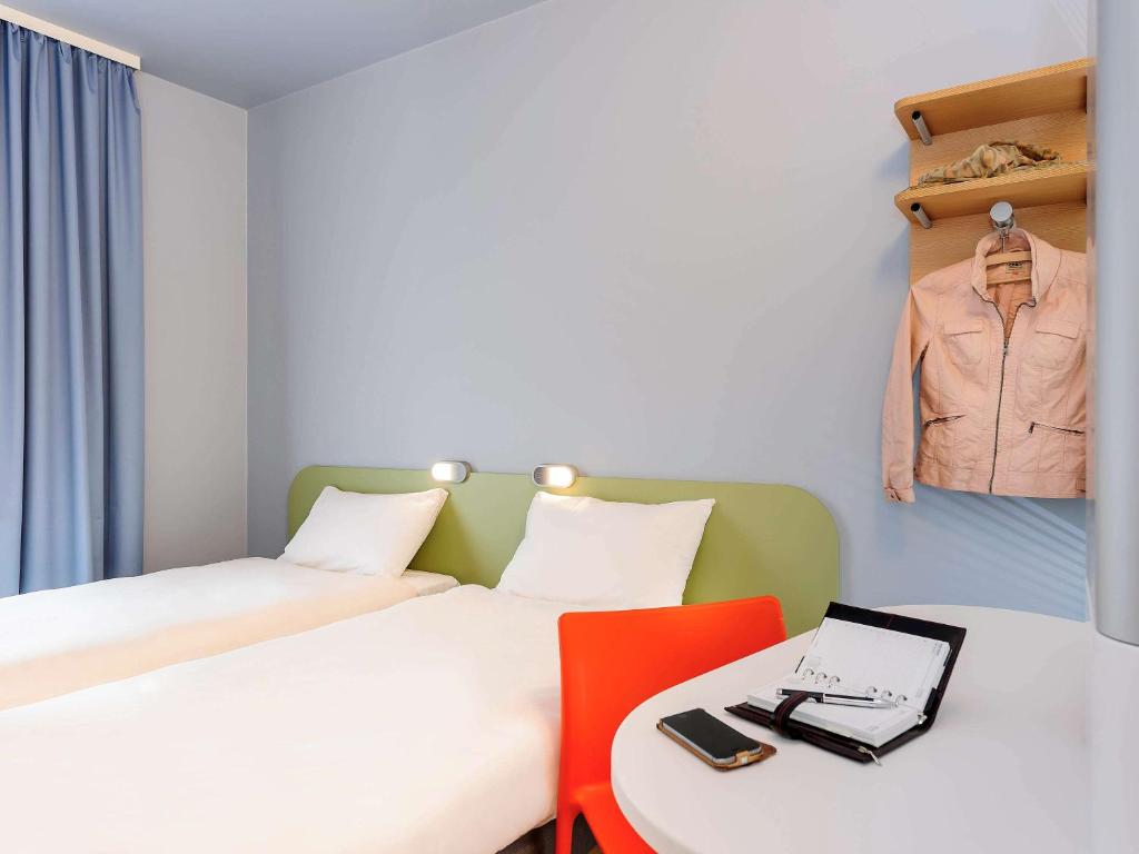 Postel nebo postele na pokoji v ubytování Ibis Budget Bamberg