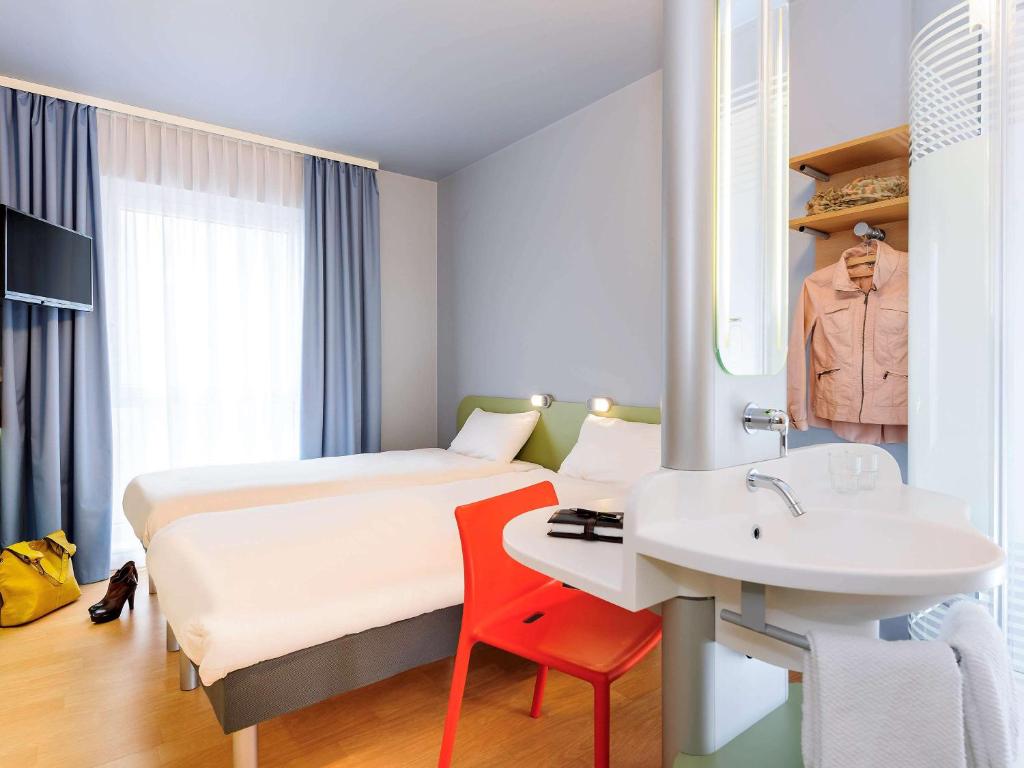 Postel nebo postele na pokoji v ubytování Ibis Budget Bamberg