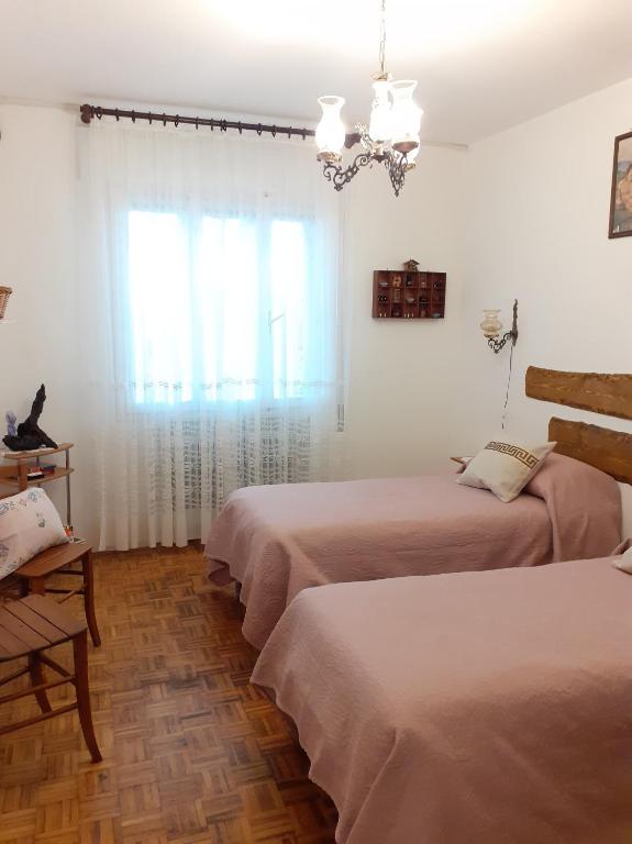 Postel nebo postele na pokoji v ubytování GrappaLand