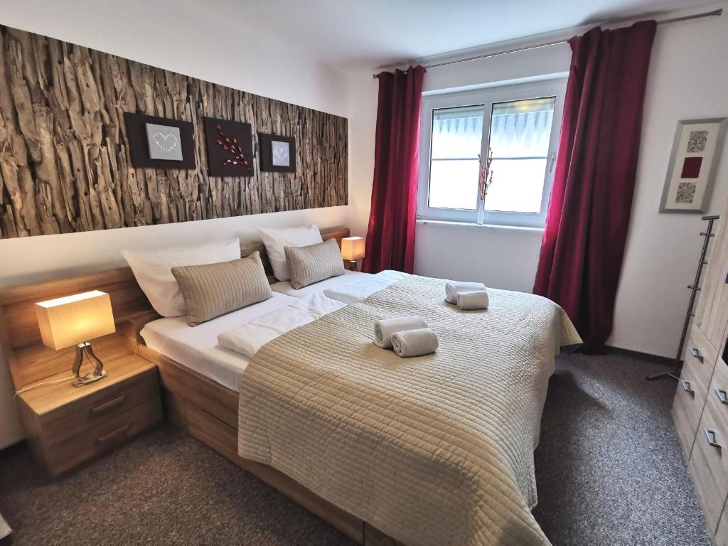 Postel nebo postele na pokoji v ubytování Apartments mit Flair
