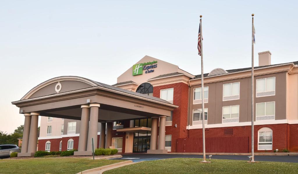 a hotel building with a flag in front of it at Holiday Inn Express Hotel & Suites Selma, an IHG Hotel in Selma