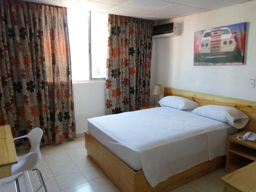 Postel nebo postele na pokoji v ubytování Hotel California Panama