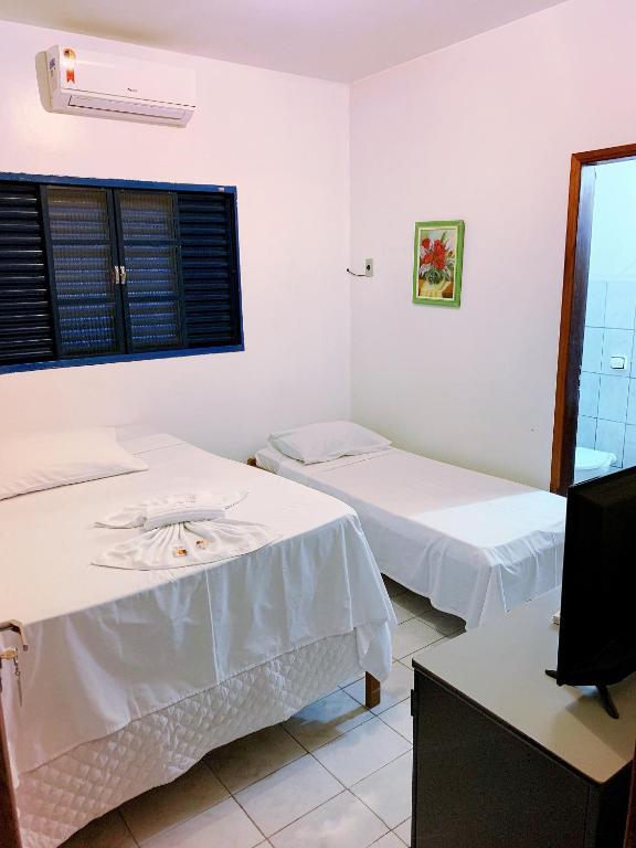Postel nebo postele na pokoji v ubytování Hotel Morada Nobre