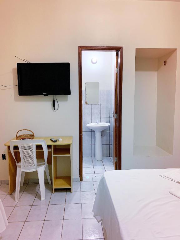 TV a/nebo společenská místnost v ubytování Hotel Morada Nobre