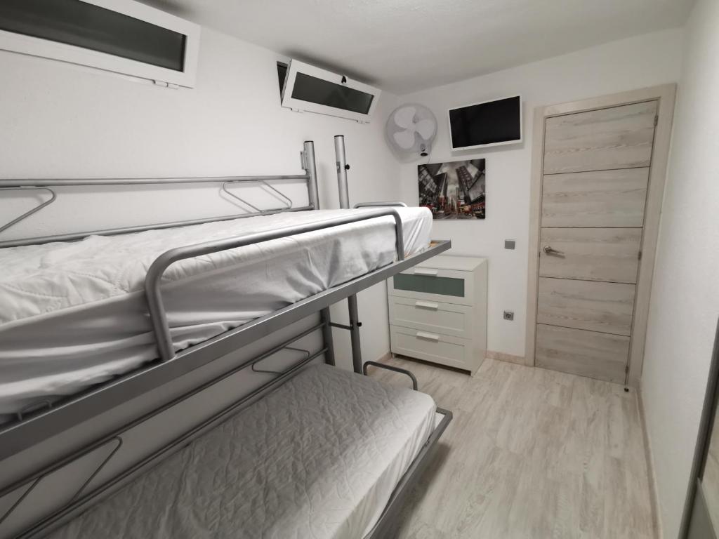 Posteľ alebo postele v izbe v ubytovaní APARTAMENTO GALTOR 6
