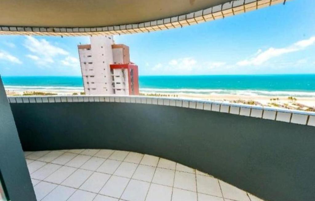 a balcony with a view of the beach at Apto Vista Beira Mar - Praia do Futuro a 100 mt da Praia in Fortaleza