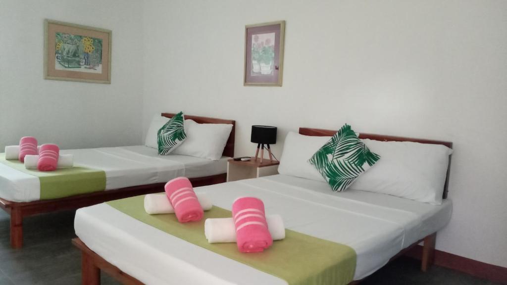 Postel nebo postele na pokoji v ubytování MR Holidays Hotel