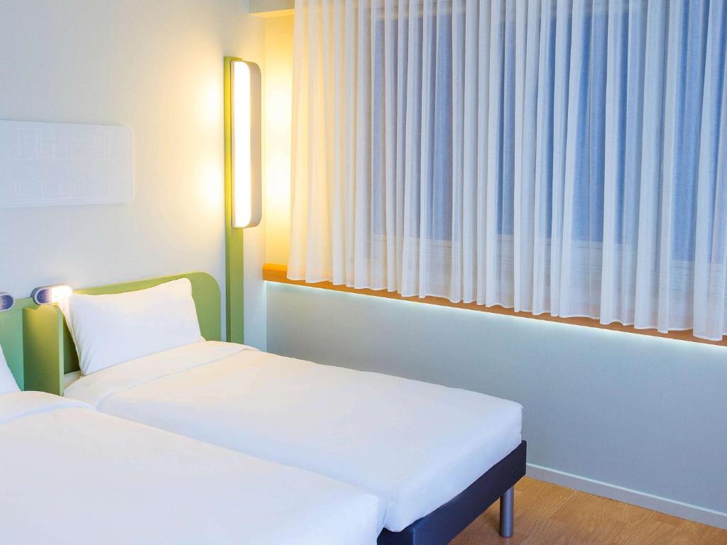 Cama o camas de una habitación en Ibis Budget Braga Centro