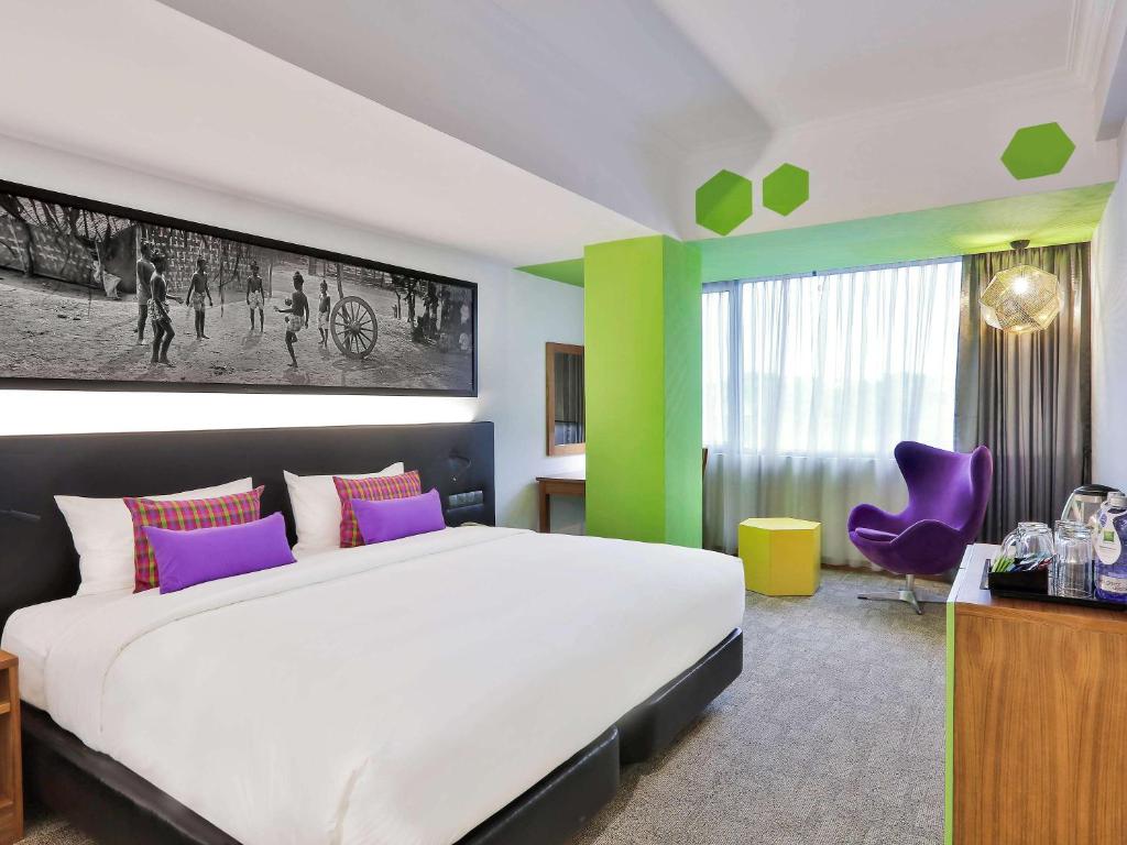 Postel nebo postele na pokoji v ubytování Hotel Stadium