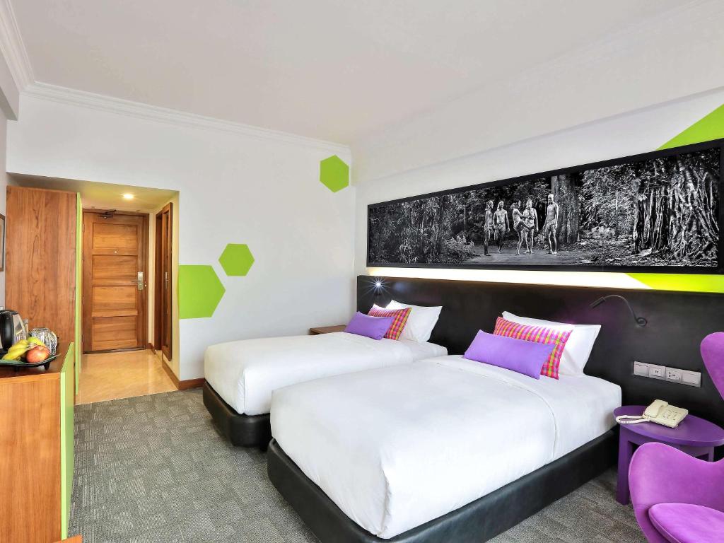Postel nebo postele na pokoji v ubytování Hotel Stadium