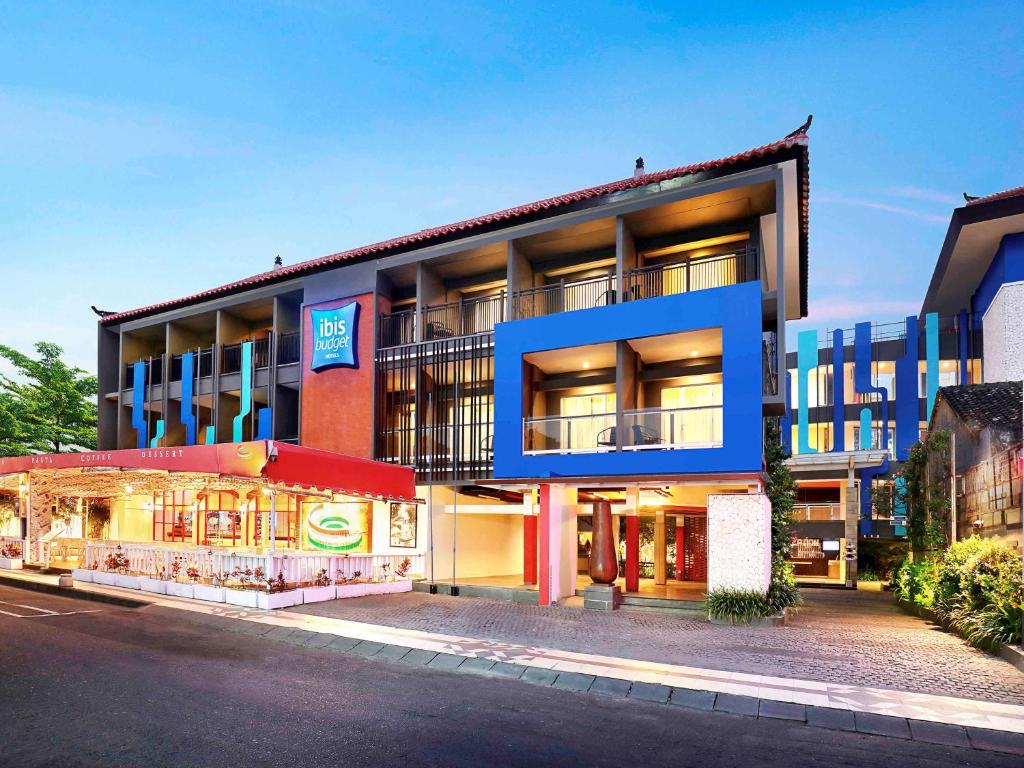 a building with a restaurant in front of it at Primera Hotel Seminyak in Seminyak