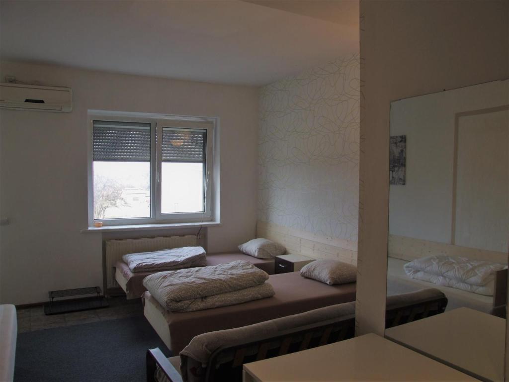 Postel nebo postele na pokoji v ubytování Jurgis Guest house