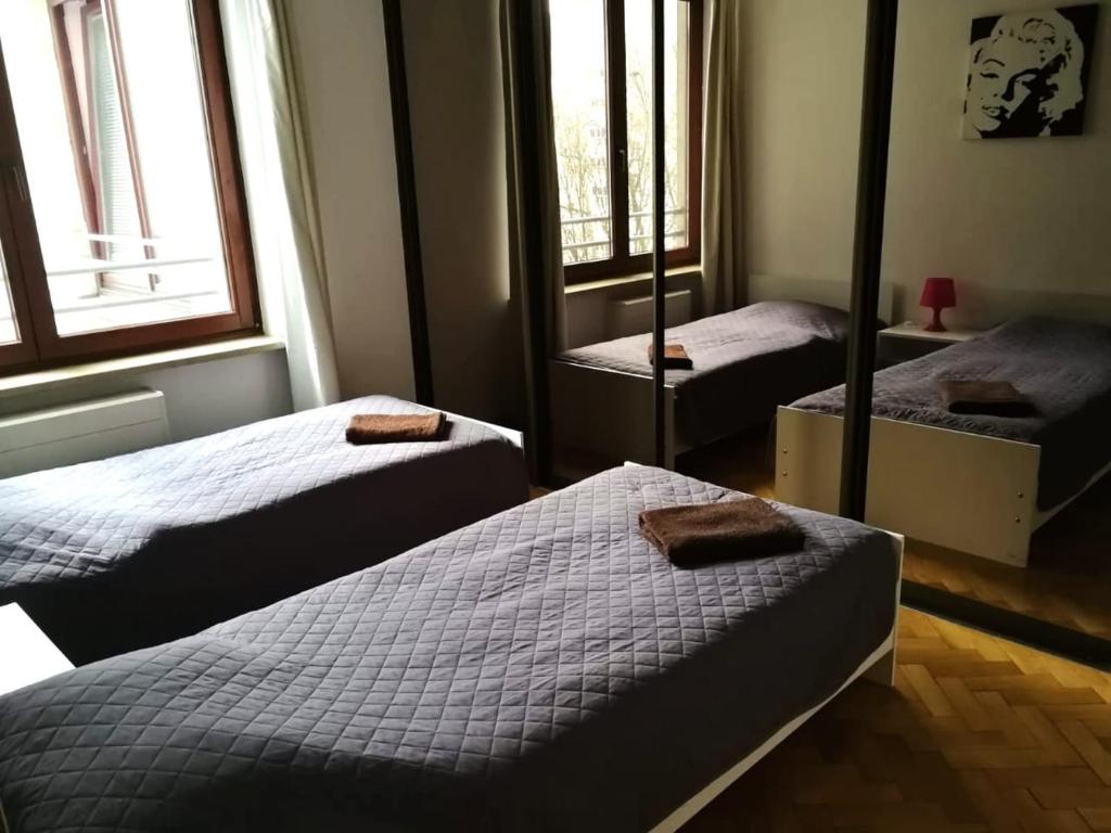 Posteľ alebo postele v izbe v ubytovaní Center Warsaw - Apartmenty Jana Pawła II