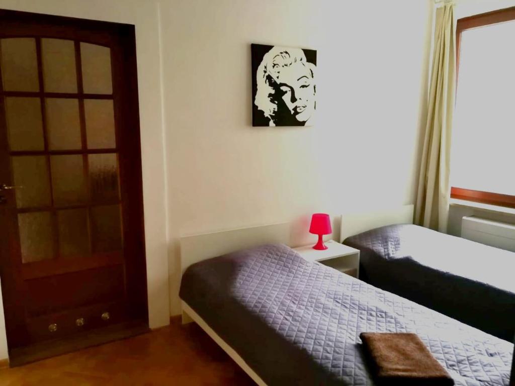 Posteľ alebo postele v izbe v ubytovaní Center Warsaw - Apartmenty Jana Pawła II