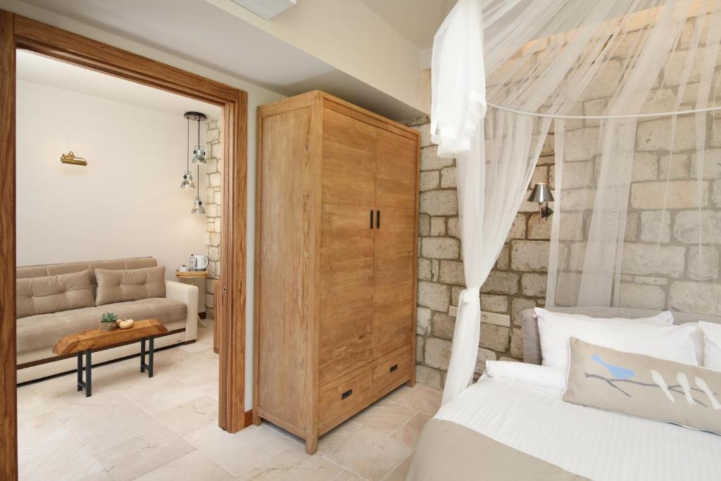 Postel nebo postele na pokoji v ubytování Alacati Kapari Hotel - Special Category