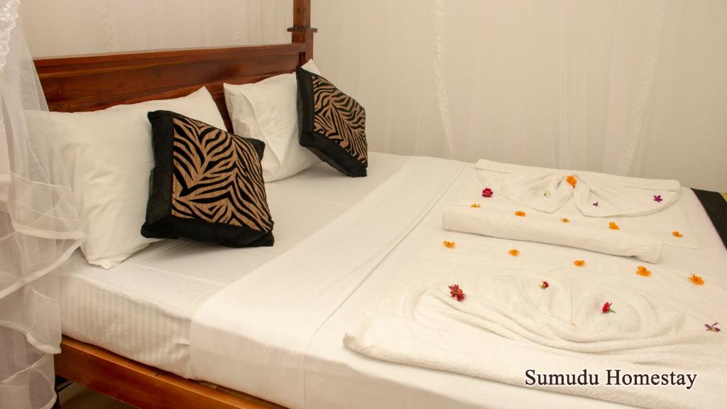 Postel nebo postele na pokoji v ubytování Sumudu Homestay