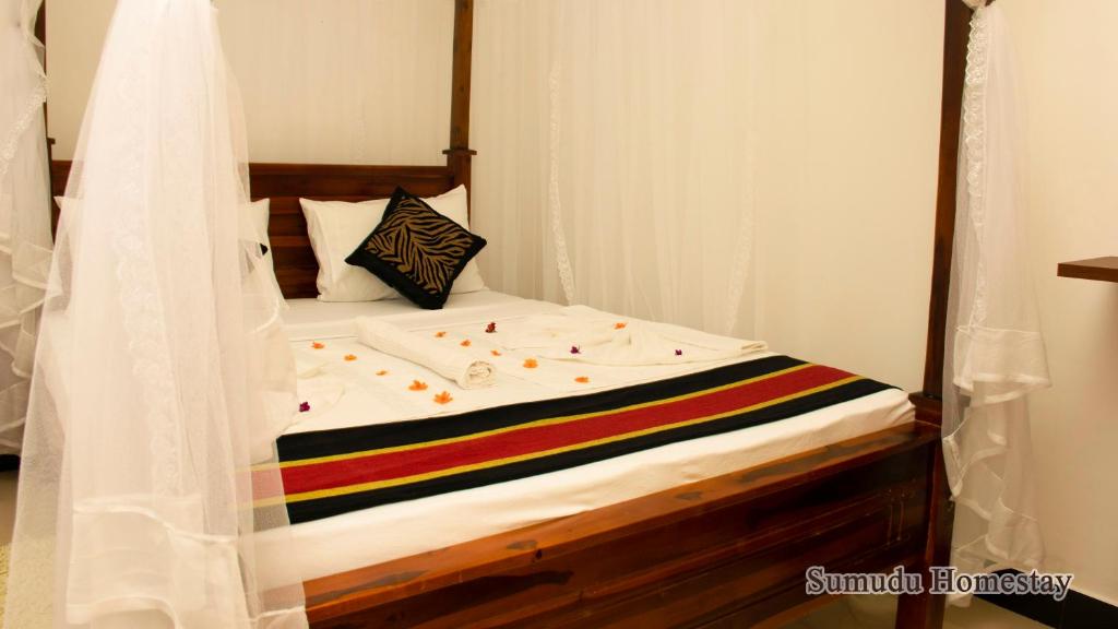 Postel nebo postele na pokoji v ubytování Sumudu Homestay
