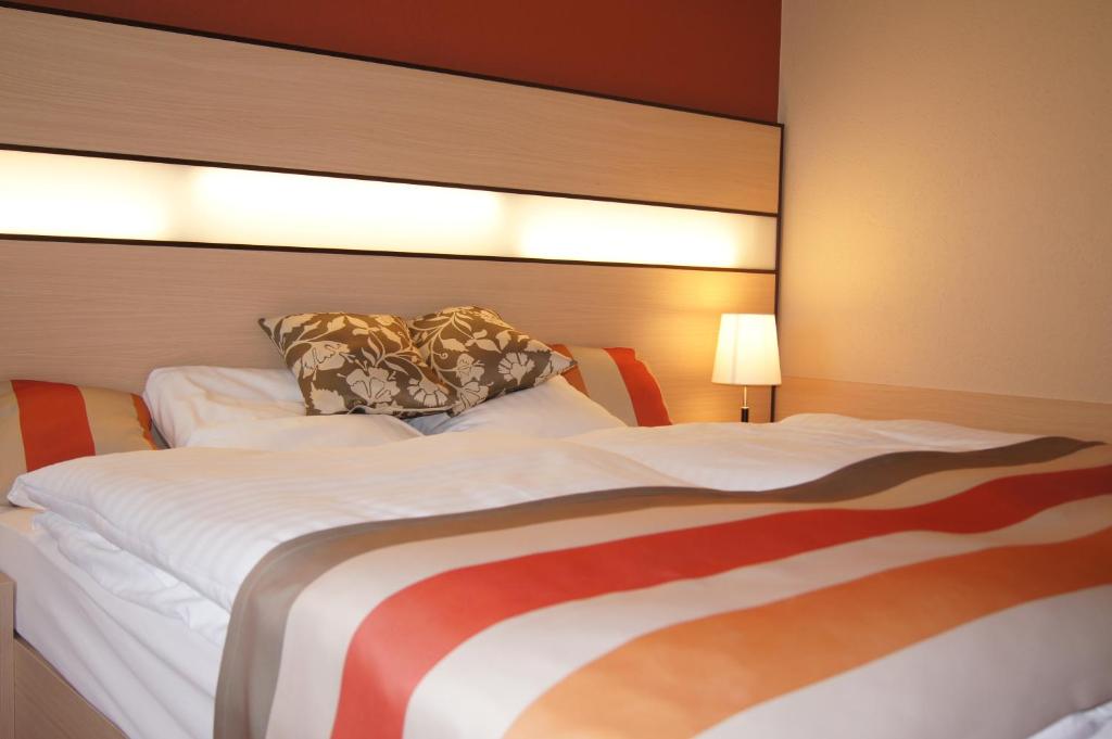Postel nebo postele na pokoji v ubytování Hotel Lacotel