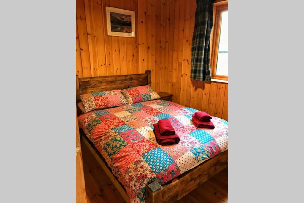 Postel nebo postele na pokoji v ubytování Fern Lodge