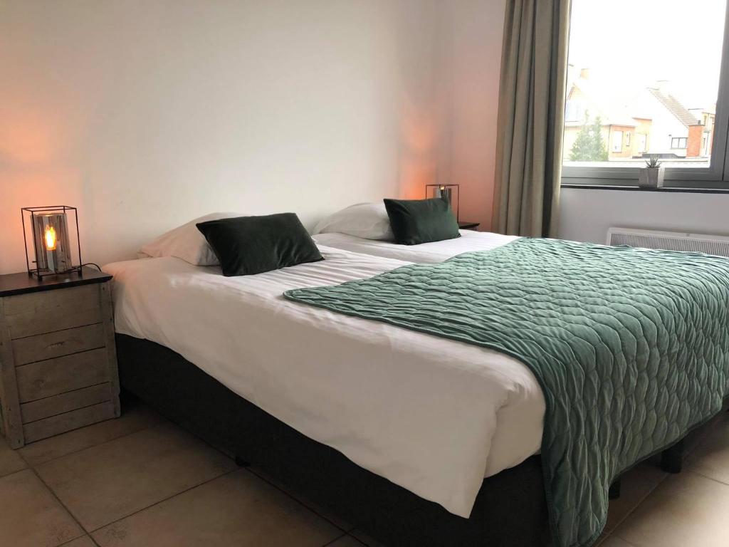 Postel nebo postele na pokoji v ubytování Apartment Fruithof Tack