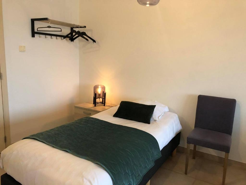 Postel nebo postele na pokoji v ubytování Apartment Fruithof Tack