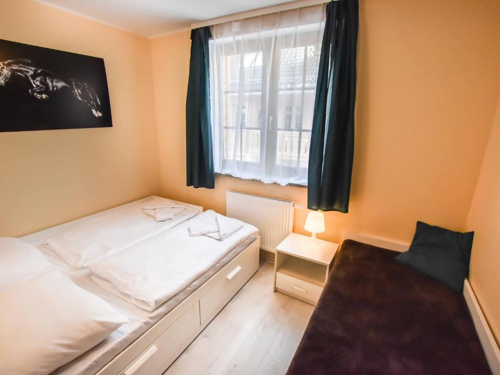 Posteľ alebo postele v izbe v ubytovaní VacationClub – Osiedle Podgórze 1E Apartament 19