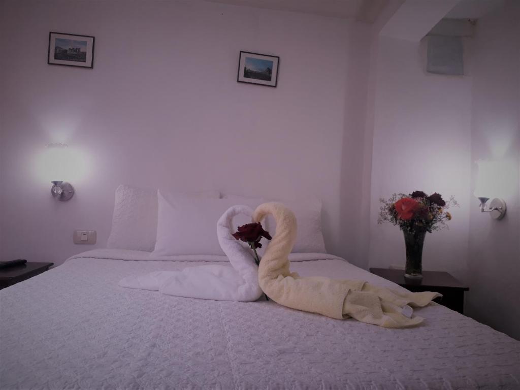 Letto o letti in una camera di Hostal Tu Hogar