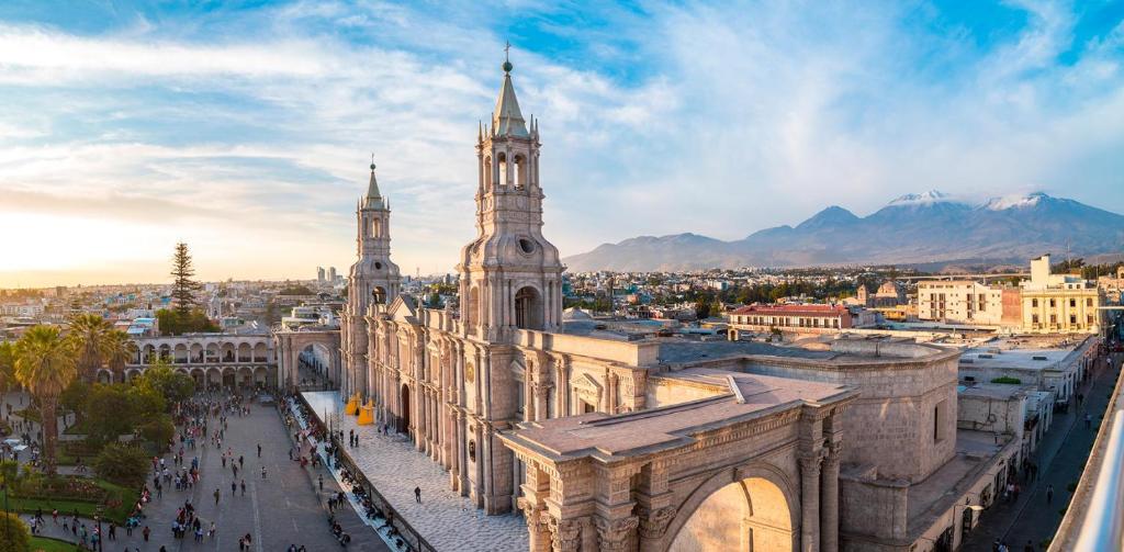 an aerial view of a city with a cathedral at PRIVATE ROOMS / DOWNTOWN AREQUIPA in Arequipa