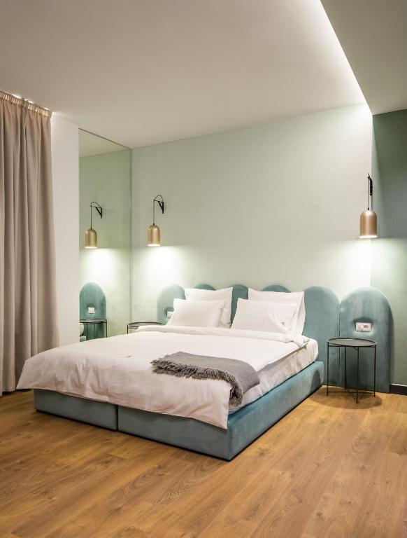 Postel nebo postele na pokoji v ubytování Allure Boutique Hotel