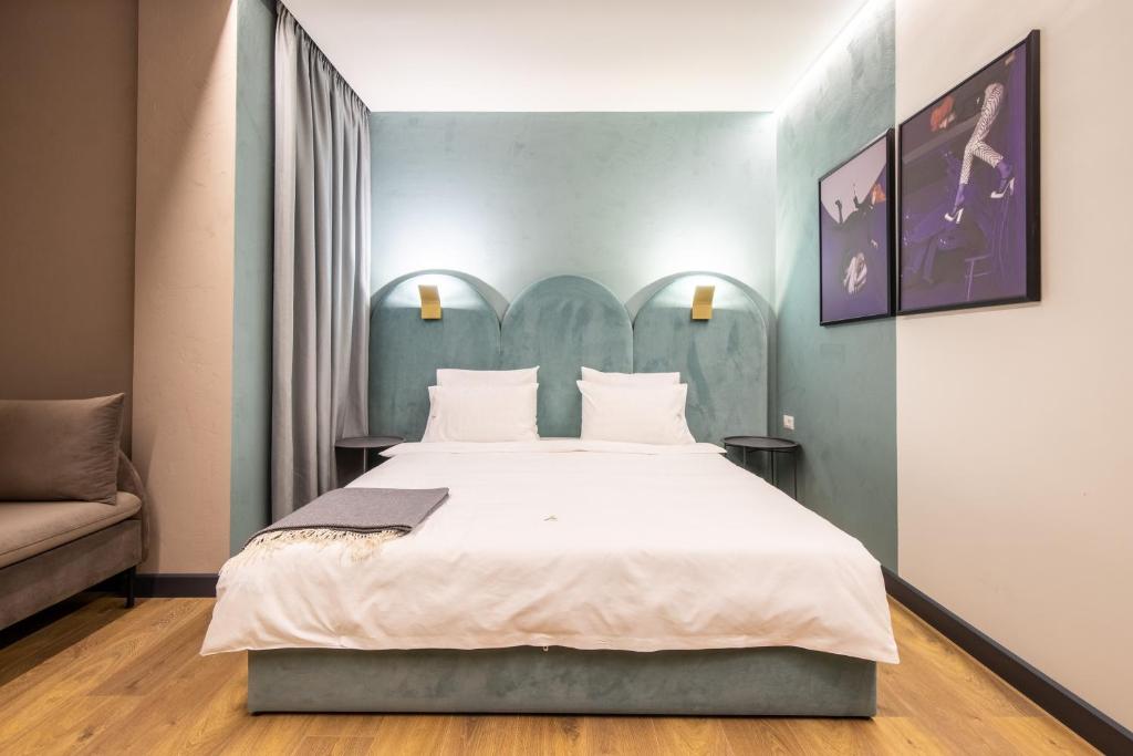 Postel nebo postele na pokoji v ubytování Allure Boutique Hotel