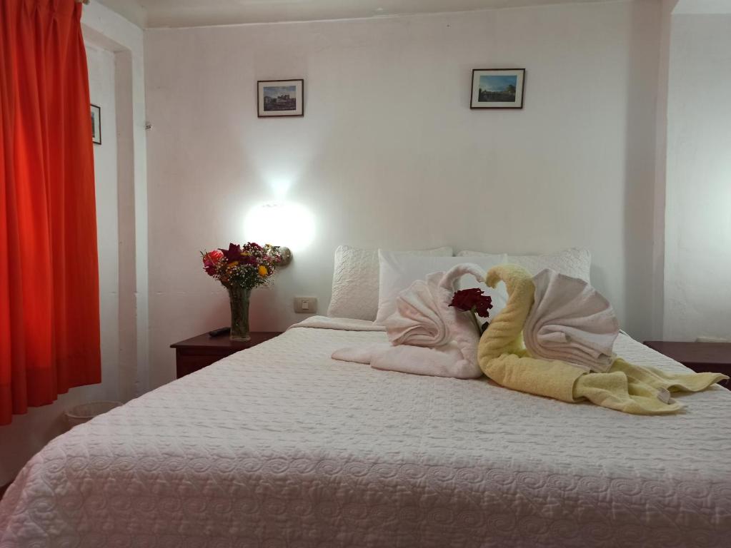 Letto o letti in una camera di Hostal Tu Hogar