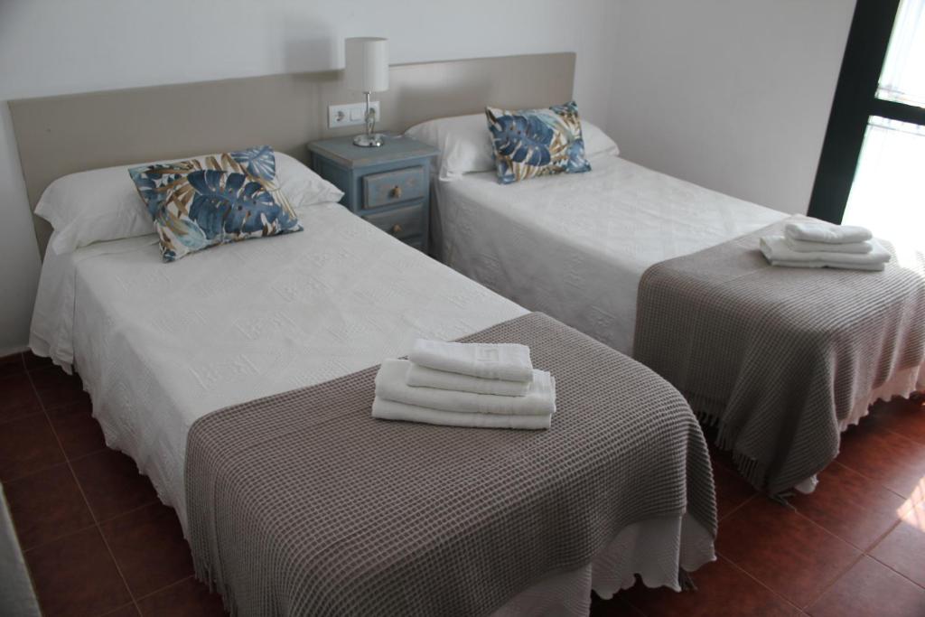 
Cama o camas de una habitación en Apartamentos Peregrinos
