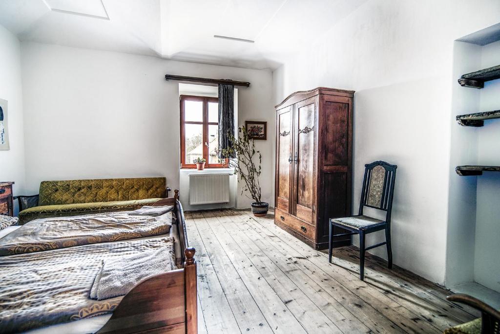 Postel nebo postele na pokoji v ubytování Statek Luníkov