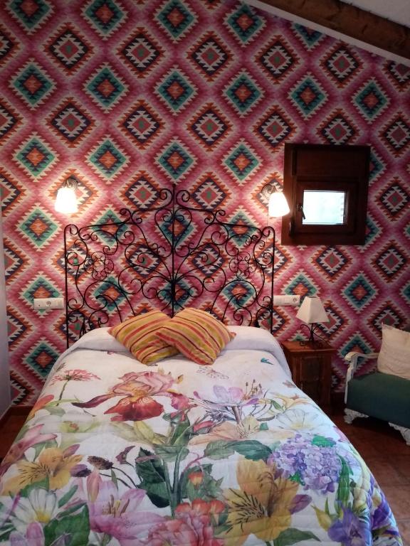 A bed or beds in a room at Hotel Rural El Marquesito Antigua Casa Carmela