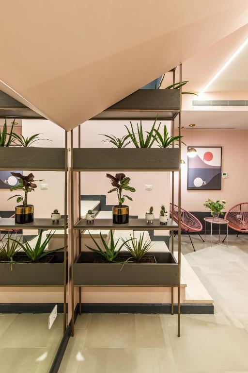 Postel nebo postele na pokoji v ubytování Allure Boutique Hotel