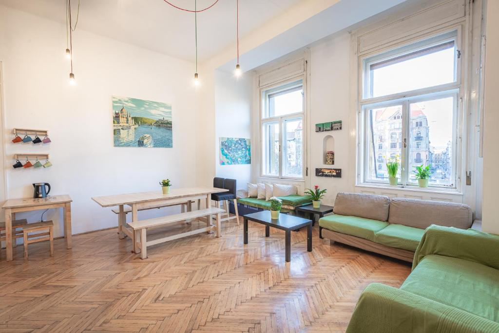 a living room with a couch and a table at Spicy Hostel in Budapest