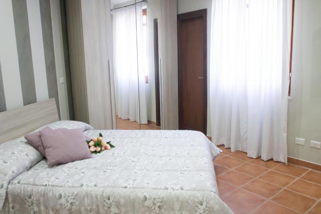 Postel nebo postele na pokoji v ubytování L'Alberata dei Sogni