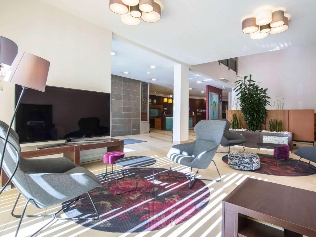 TV a/nebo společenská místnost v ubytování Hotel Mercure Graz City