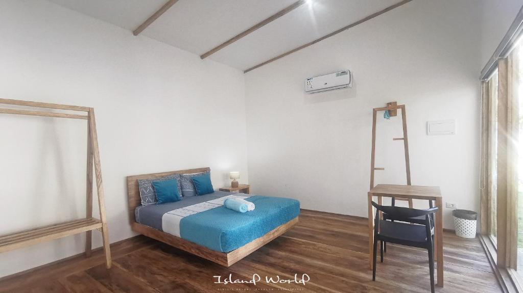 Postel nebo postele na pokoji v ubytování Island World Panglao