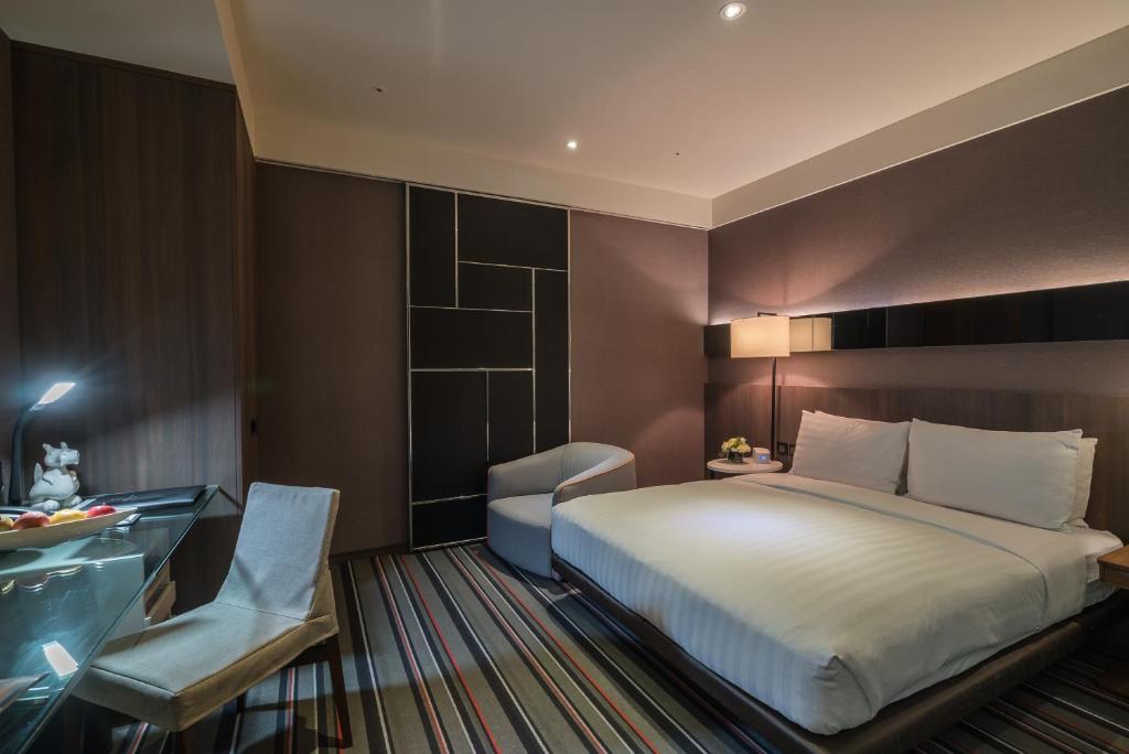 Postel nebo postele na pokoji v ubytování WESTGATE Hotel