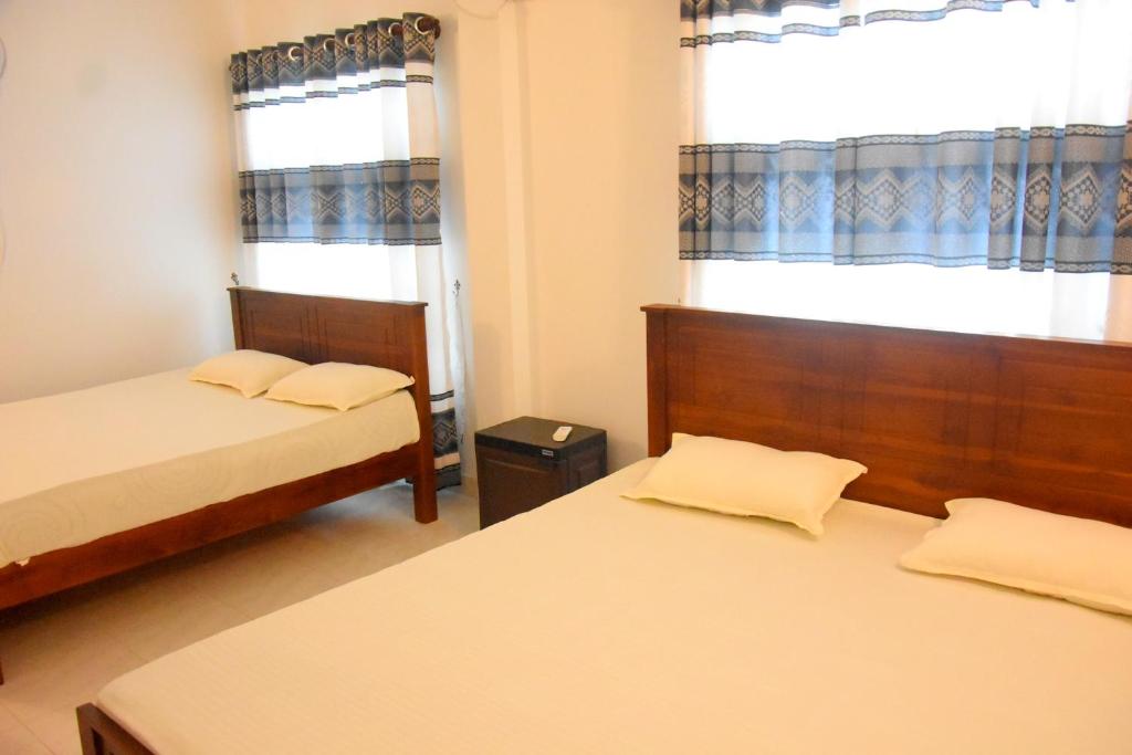 Postel nebo postele na pokoji v ubytování Wingate Hotel Wilgamuwa