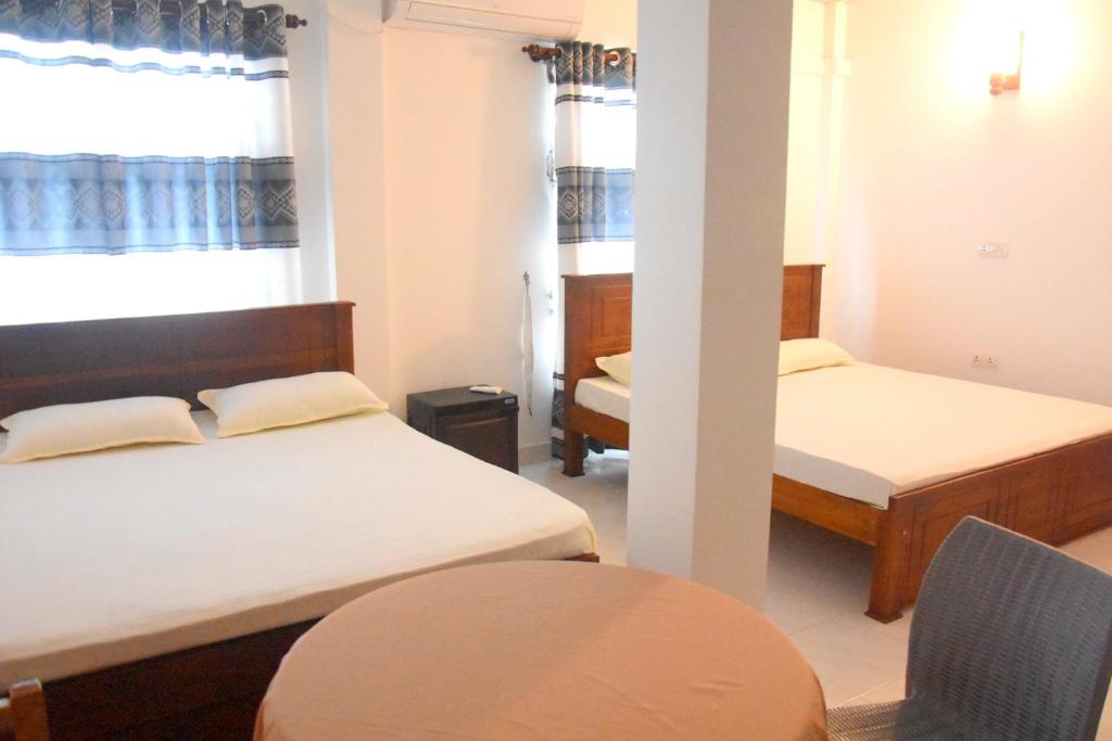 Postel nebo postele na pokoji v ubytování Wingate Hotel Wilgamuwa